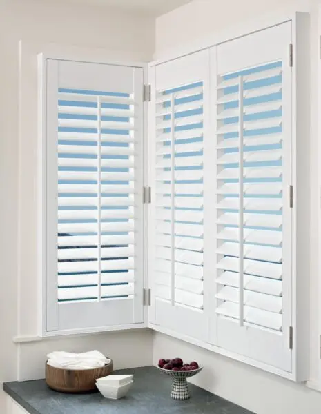 Palm Beach Polysatin Shutters cornerwindow kitchen detail